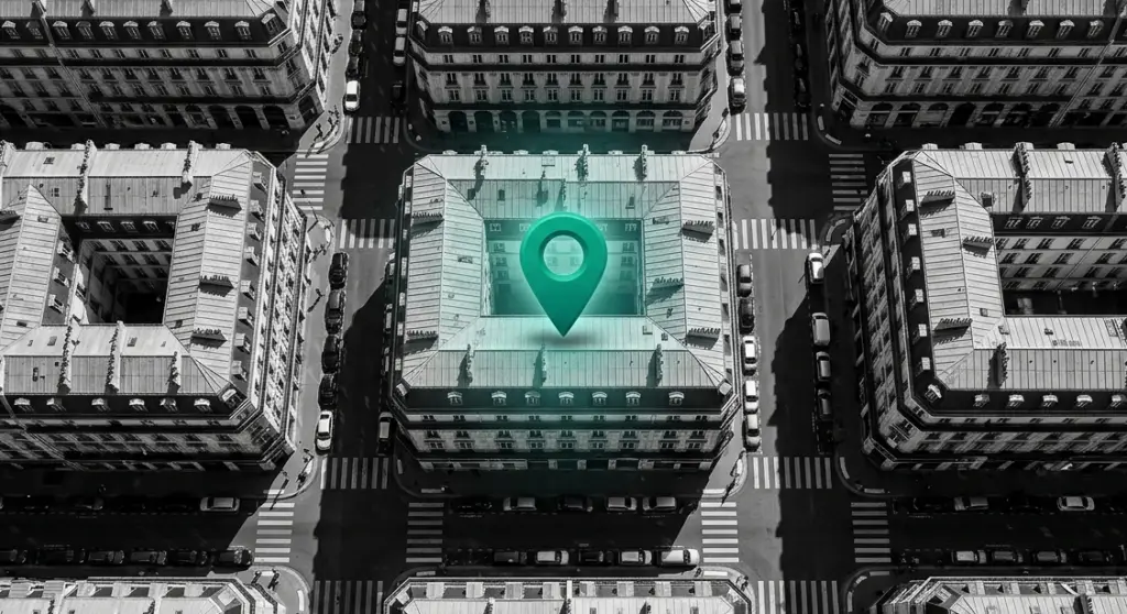 Vue aérienne d'un quartier français avec un marqueur de localisation — SEO local pour cabinet dentaire et visibilité sur Google